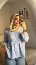بلوزة بليسيه باللون الأزرق الفاتح