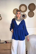 بلوزة لفّ زرقاء