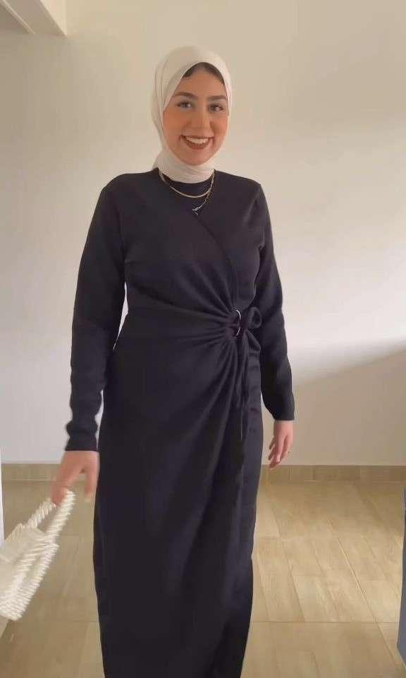 Black Rib-Knit Dress With a Metal Ring.